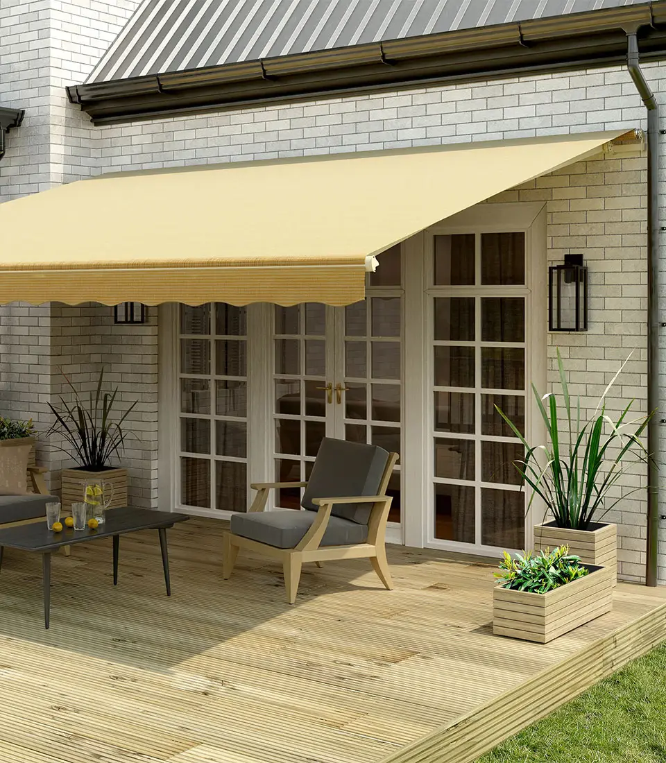 Tan awning covering backyard patio